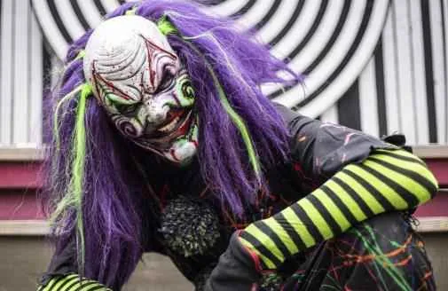 Twisty clown haunted house character at SC Fear Farm